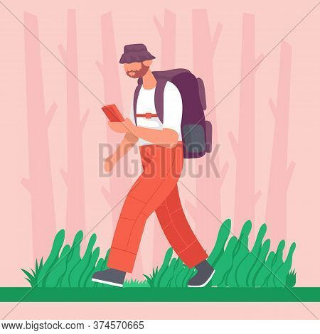Guy Goes With A Backpack In With A Phone In His Hands On A Hike. Concept For Hiking Outdoors. Color 