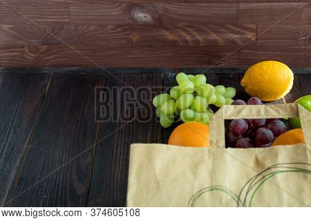 Fruits In A Paper Bag. Orange, Lemon, Apple, Grapefruit, Grapes