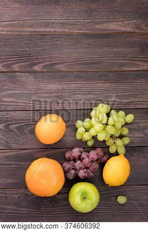 Fruits On A Wooden Table. Located On The Bottom