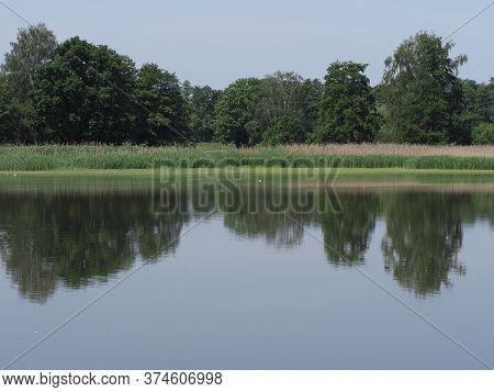 Forest Reflected In Waters Of Artificial Breeding Pond In European Goczalkowice Town At Silesian Dis