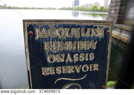 New York City, Usa - May 01, 2019: Sign Of Jacqueline Kennedy Onassis Reservoir In Central Park. New