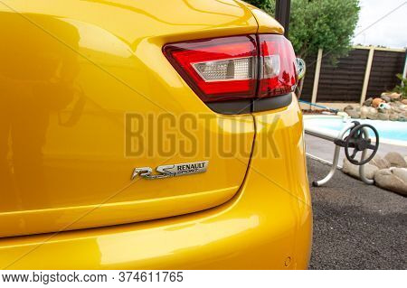 Bordeaux , Aquitaine / France - 06 20 2020 : Renault Clio Rs Yellow Car Detail Of Logo Sign On Sport