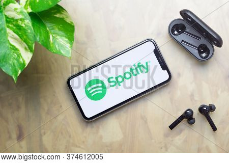 Bangkok, Thailand - July 3, 2020: Apple Iphone 11  With Spotify Logo On Display, Bluetooth Headphone