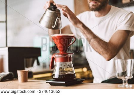 Close Up Photo Of Barista At Bar Counter Preparing Coffee In Pour Over And Hario Style While Working