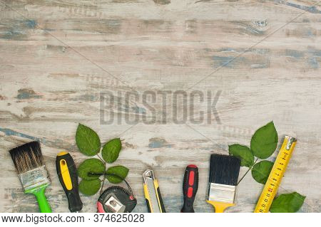 Various Tools On A Wooden Background. Happy Fathers Day Greeting Card Concept. Copy Space