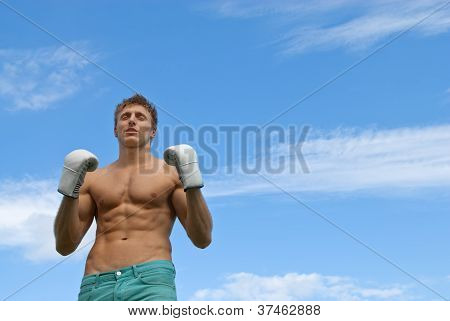 Athletic Young Man In Boxing Gloves