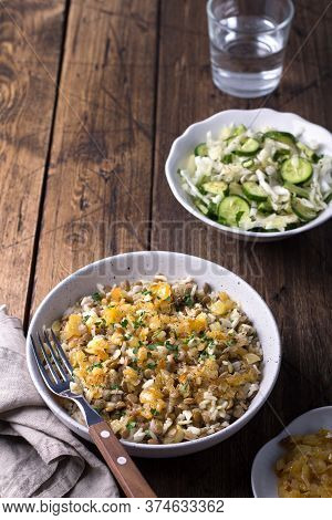 Traditional Middle Eastern Dish, Mujadara Of Lentils, Rice And Fried Onions With A Salad Of Cabbage 