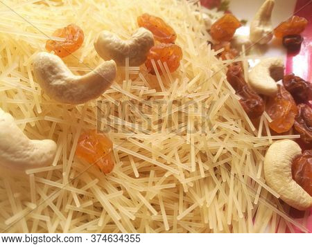 A Bright Pic Of Cashew Nuts And Dry Grapes Placed On The Top Of The Vermicelli Taken In A Plate.all 