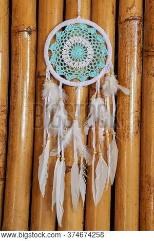 Dream Catcher With Blue Turquoise Threads Closeup In The Interio