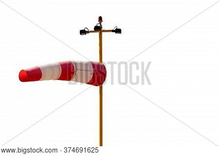 Wind Direction Indicator Isolated On White Background. Red White Airsock Cone In The Wind