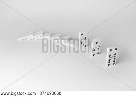 Domino Effect. Dominoes Isolated On White Background. Concept Of Social Distancing.