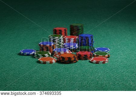 Poker Chips On A Green Cloth. 3d Illustration.