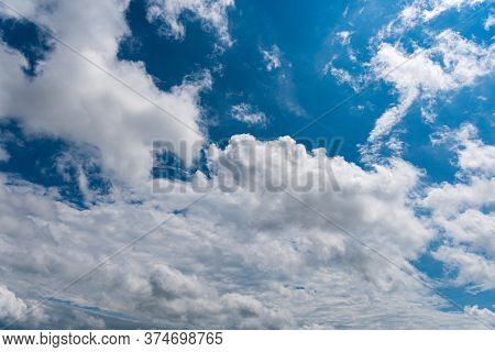 White Fluffy Clouds In The Blue Sky
