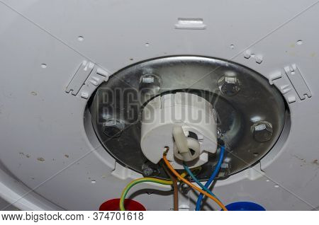 Bottom Of The Outboard Water Heater Before Disassembling. Leaking Home Boiler. Repair And Maintenanc