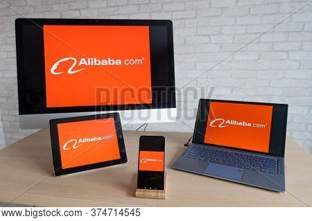 Alibaba Logo On Computer Screens, Laptop Digital Tablet And Smartphone. Applications For All Devices