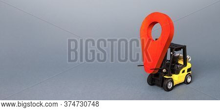 Forklift Carries A Red Pin Location Navigation Symbol Pointer. Transportation And Delivery Services.