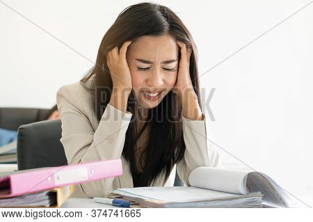 Overworked Asian Business Woman Have Migraine Headache In The Workplace. Stressed Female Employee Ru
