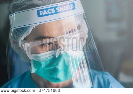 Nurse Having Tired From Work While Wearing Ppe Suit For Protect Coronavirus Disease. Ppe While Prote