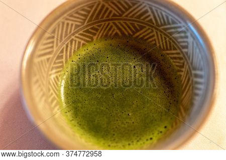 A Bowl Of Matcha Green Tea Served During Traditional Japanese Tea Ceremony