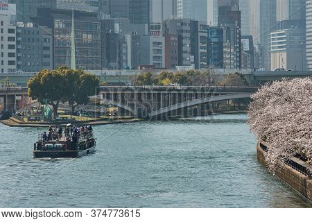 Osaka / Japan - March 28, 2018: Tourist River Cruise Ship Himawari Sailing The Okawa River With Bloo