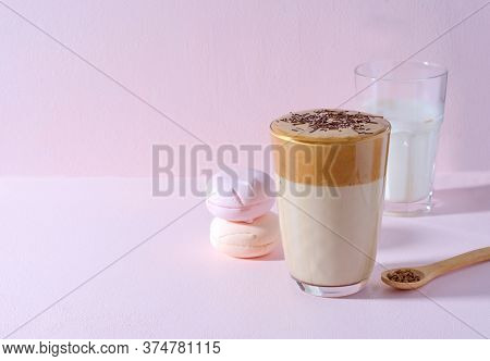 Korean Coffee Dalgon In High Glass On A Pink Background. Nearby Lies A Wooden Spoon With Coffee, In 