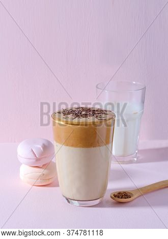 Korean Coffee Dalgon In High Glass On A Pink Background. Nearby Lies A Wooden Spoon With Coffee, In 
