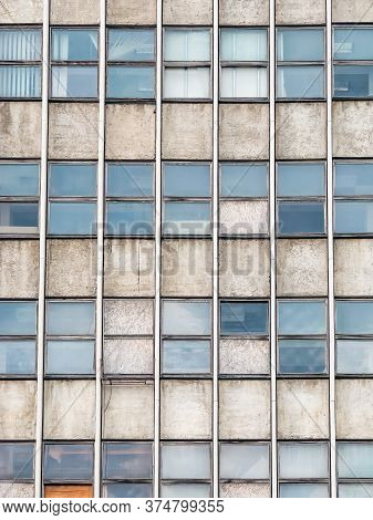 Detail With Very Old Office Building From Communist Era. Worn Out Office Building.