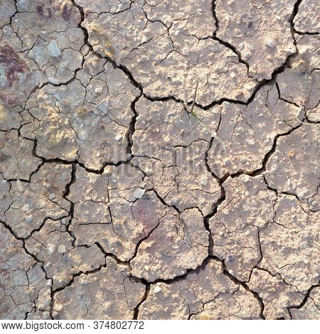 Detail Of Cracked Loam As Symbol Of Heat