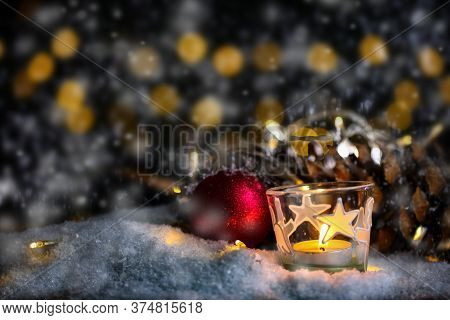 Christmas Theme With Candles, Snow, Pine Cone And Christmas Light