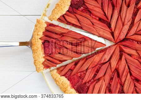 Сдщыугз рomemade Rhubarb And Strawberry Pie On White Wooden Table.