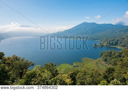 View Of Lake Buyan On Bali Island, Indonesia. It's Bali's Second Biggest Lake. Volcanoes Have Create