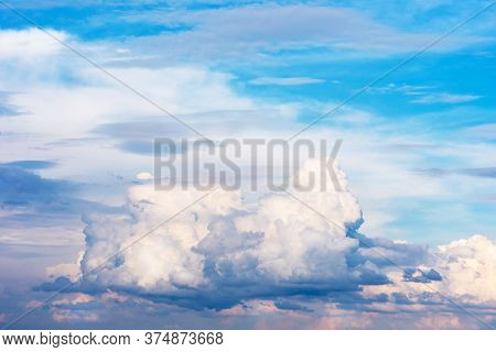 Beautiful Pink, Blue Clouds And Blue Sky. Clouds Reflect The Sunset With A Beautiful Iridescence.