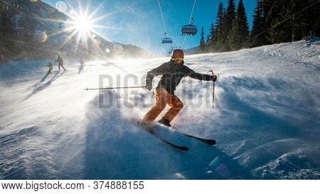 Teenage Skier Braking From High Speed On A Slope