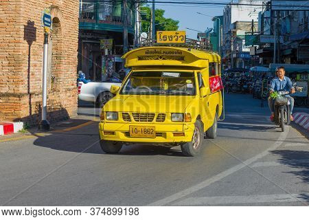 Chiang May, Thailand - December 22, 2018: Yellow Sontego On A City Street In The Old City