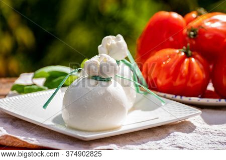 Fresh Italian White Soft Cheese Burrata Or Burratina Served On Outdoor Terrace In Sunny Day