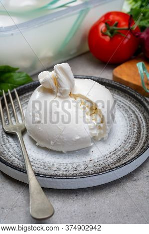 Eating Of Fresh Handmade Soft Italian Cheese From Puglia, White Balls Of Burrata Or Burratina Cheese