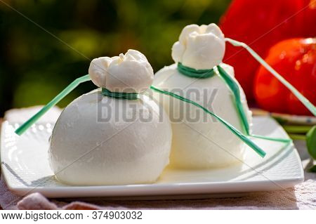 Fresh Italian White Soft Cheese Burrata Or Burratina Served On Outdoor Terrace In Sunny Day