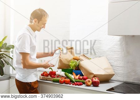 Happy Male Customer Open Cardboard Box Receive Postal Mail Delivery Package, Smiling Young Man Satis