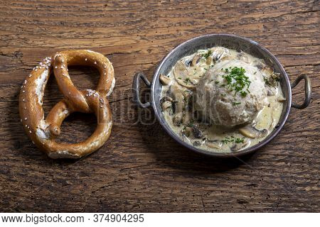 Bavarian Bread Dumpling With Sauce On Wood