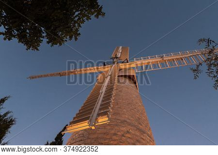 Jerusalem, Israel, June 26, 2020 : The Famous Montefiore Windmill Built In 1857, Now With Neighborho