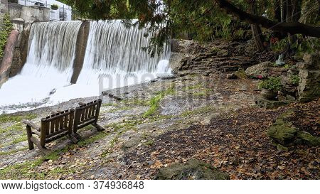 Caledon, Ontario / Canada - 10/09/2015: Empty Bench At The Millcroft Waterfall In Caledon, Ontario, 