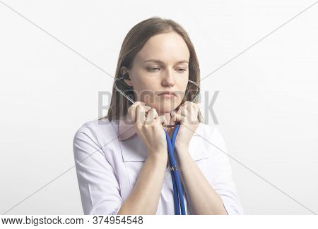 Close Up Portrait Of Young Caucasian Doctor Woman With Stethoscope For Using In Clinic Or Hospital O