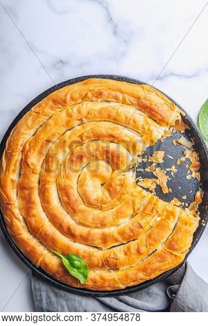 Filo Spinach And Feta Twist Pie In The Iron Pan After Oven. Authentic Greek Bakery. With Spinach, Mi