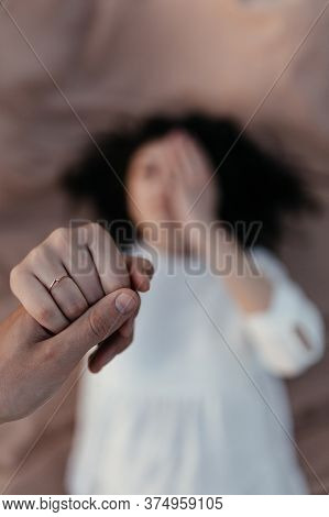 Man Holding Happy Fiance Hand With Gold Engagement Ring On Her Finger After Wedding Proposal. Young 
