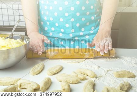 Cooking Vegetarian Dumplings With Mashed Potatoes (kreplach, Jewish Ravioli) In Home Kitchen. Female