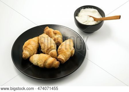 Traditional Rolled Dough Called Kiflice Served Wuth Chease And Yogurt On Black Plate And White Backg