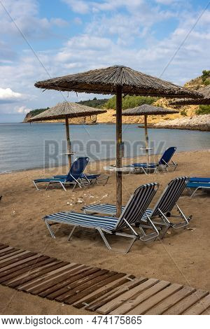 Calm Morning After A Night Rain In The South Of The Island. Beach Still Empty, But All The Deck Chai