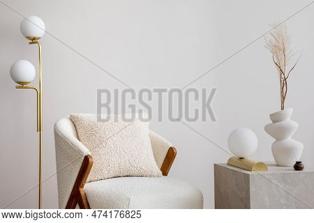 Warm And Cozy Living Room With White Armchair, Lamp, Consola And Personal Accessories. Beige Wall. H