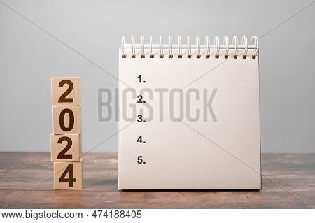 Mockup 2024 Calendar. Five Points Plan 2024. Space For Your Text On Notepad. New Year 2024 Plan Conc