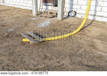 100mm Diameter Yellow Pvc Pipe Connected To The End Of The Gutter On The Roof, Protected Against Wat
